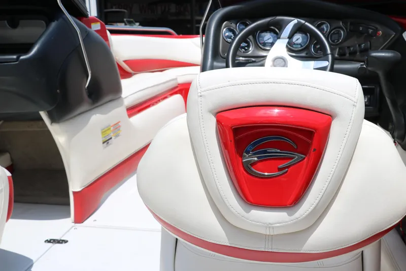 Slide: The Image of Interior of 2009 Crownline 23 SS boat, featuring red and white seating and dashboard. - 50
