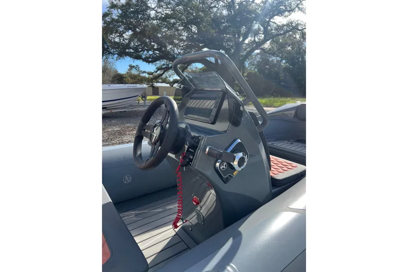 Slide: The Image of Steering console of 2026 Highfield Sport 390 boat with modern controls and sleek design. - 7