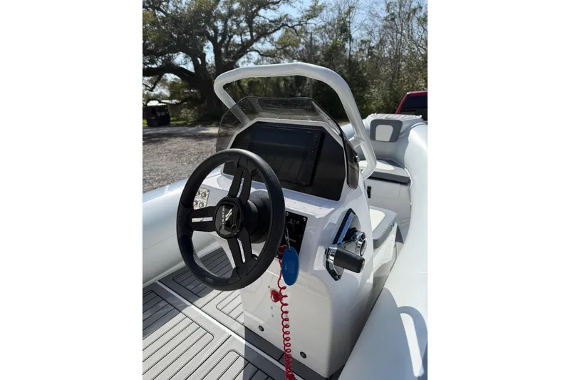 Slide: The Image of 2026 Highfield Classic 420 boat console with steering wheel and controls. - 9
