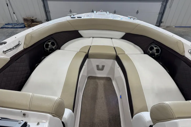 Slide: The Image of 2015 Regal 2700 Bowrider interior with beige seating and speakers. - 11
