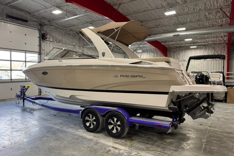 Slide: The Image of 2015 Regal 2700 Bowrider boat on trailer in indoor storage facility. - 3