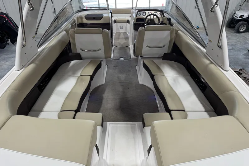 Slide: The Image of 2015 Regal 2700 Bowrider interior with beige seating and modern dashboard. - 6