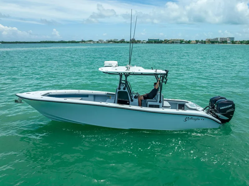 Slide: The Image of 2021 Yellowfin 29 Offshore boat on calm water. - 13