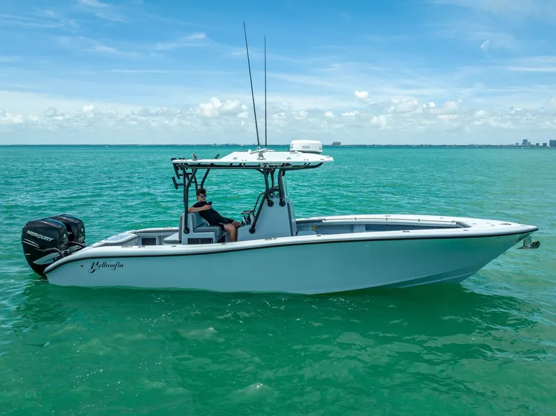 Slide: The Image of 2021 Yellowfin 29 Offshore boat on turquoise water. - 2