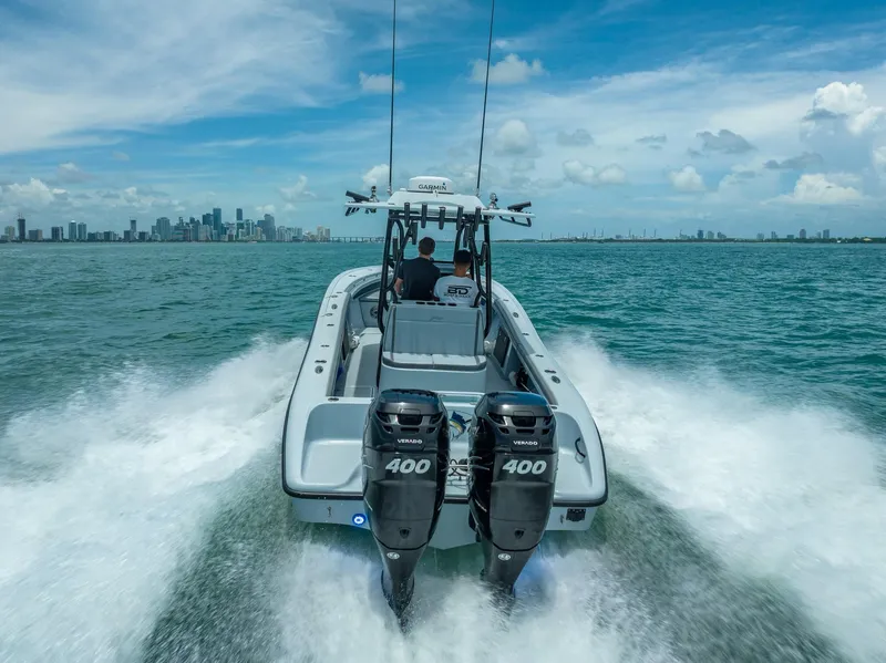 Slide: The Image of Yellowfin 29 Offshore 2021 on water with dual outboard engines. - 26