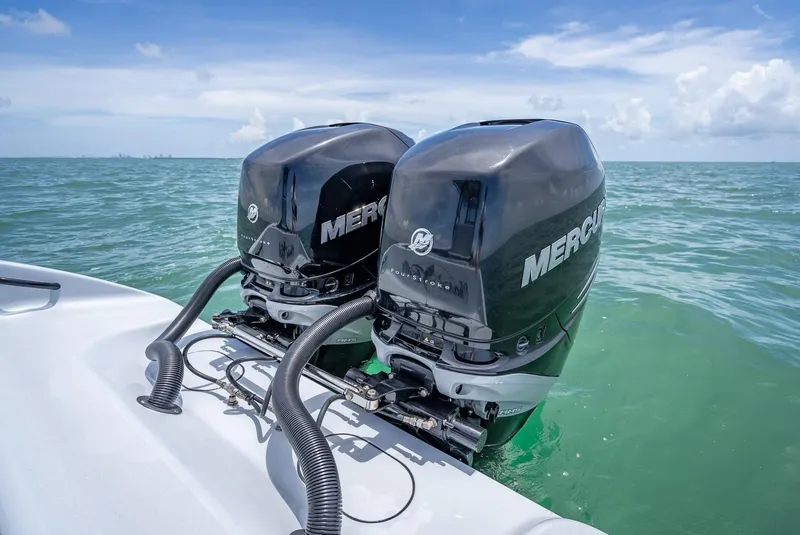 Slide: The Image of 2021 Yellowfin 29 Offshore with twin Mercury outboard engines on the sea. - 46