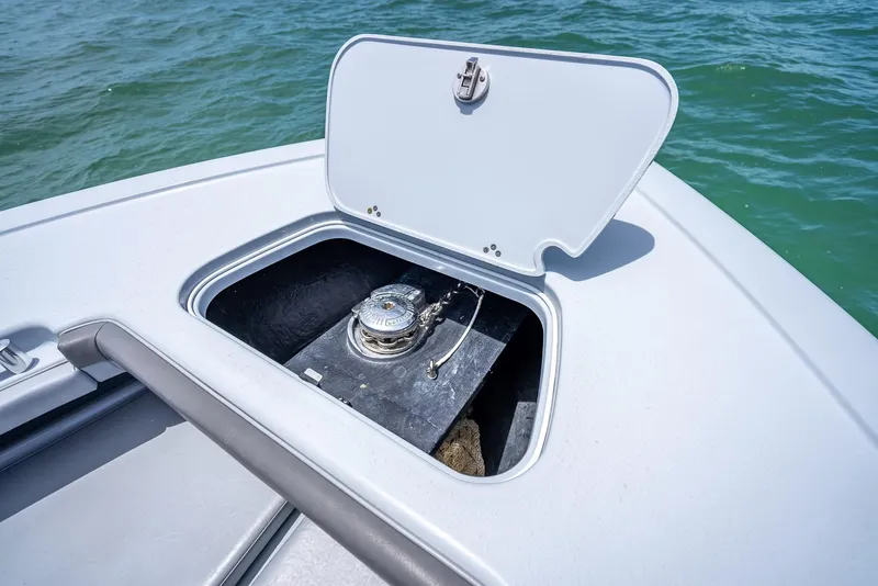 Slide: The Image of 2021 Yellowfin 29 Offshore anchor compartment on open sea. - 49