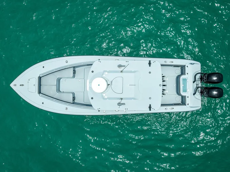Slide: The Image of Aerial view of a 2021 Yellowfin 29 Offshore boat on turquoise water. - 7