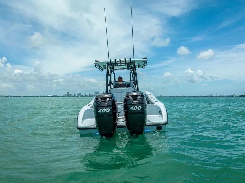 Slide: The Image of 2021 Yellowfin 29 Offshore boat on open sea with dual outboard engines. - 9