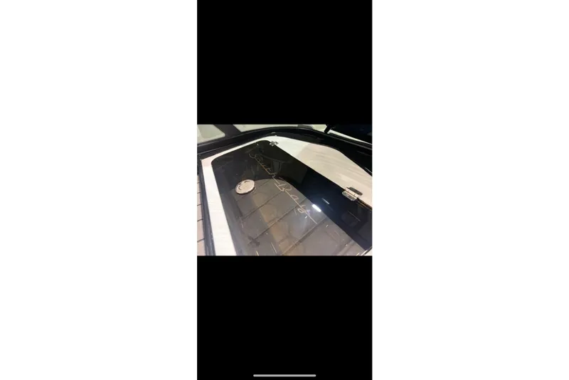 Slide: The Image of 2026 South Bay 25 Sport Twin boat interior detail with sleek design elements. - 20