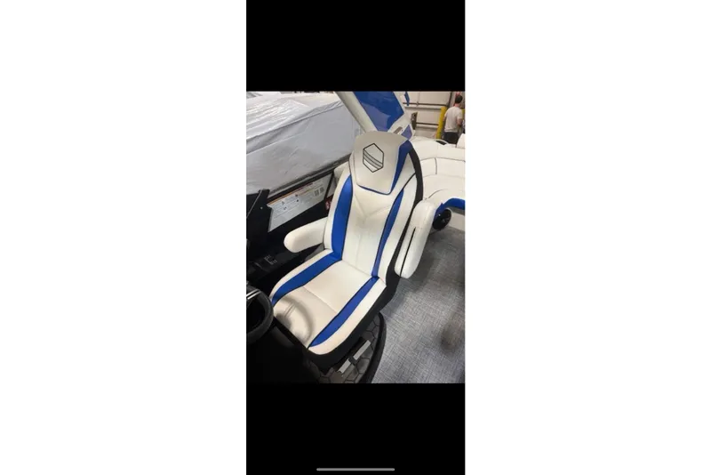 Slide: The Image of 2026 South Bay 25 Sport Twin boat seat with blue and white design. - 23