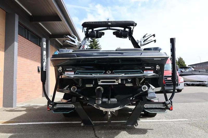 Slide: The Image of 2021 Centurion Fi23 boat rear view showcasing advanced wakeboard features. - 12