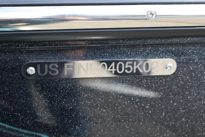 Slide: The Image of 2021 Centurion Fi23 boat hull identification number plate close-up. - 13