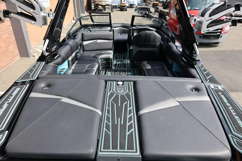 Slide: The Image of 2021 Centurion Fi23 boat interior with sleek seating and modern design. - 19