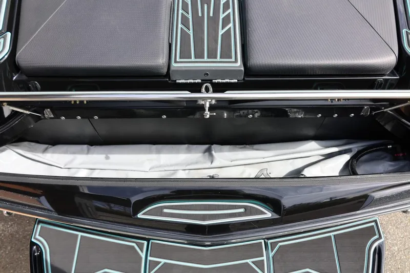 Slide: The Image of 2021 Centurion Fi23 boat interior with sleek black and teal design details. - 20