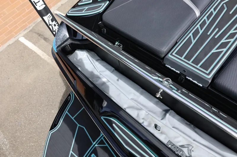 Slide: The Image of 2021 Centurion Fi23 boat interior with storage compartment and sleek design details. - 21