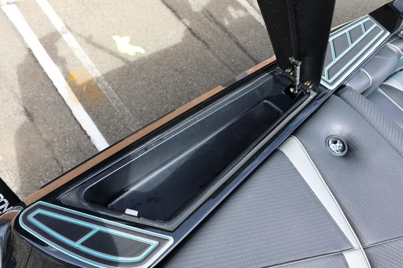 Slide: The Image of 2021 Centurion Fi23 boat storage compartment with sleek design and modern upholstery. - 26