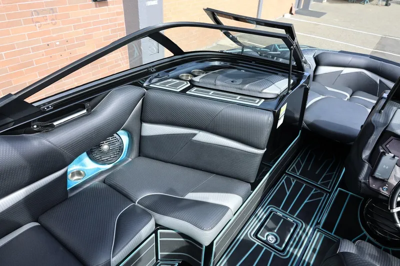 Slide: The Image of 2021 Centurion Fi23 boat interior with sleek black seating and modern design elements. - 32