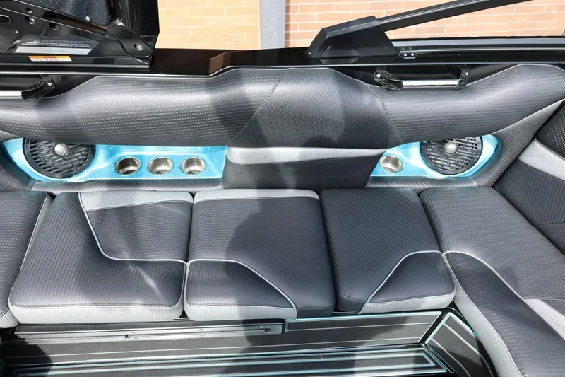 Slide: The Image of 2021 Centurion Fi23 boat interior with sleek seating and built-in speakers. - 33