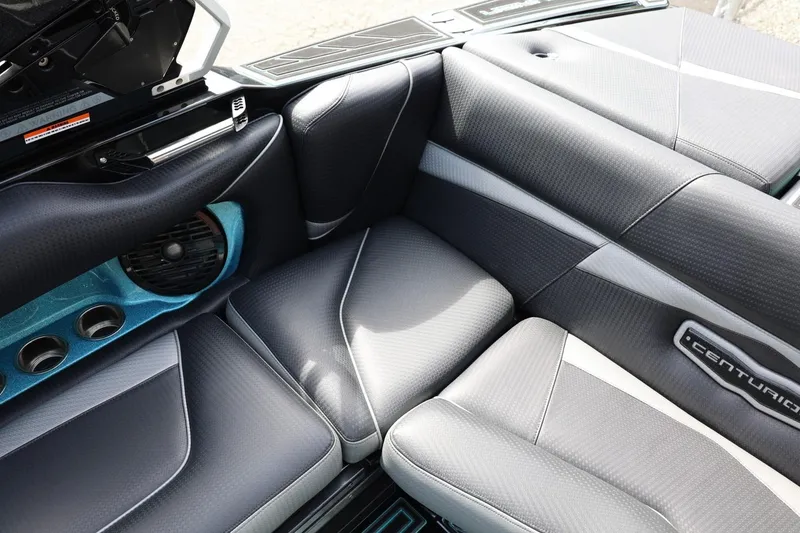 Slide: The Image of 2021 Centurion Fi23 boat interior with sleek gray seating and speaker system. - 36