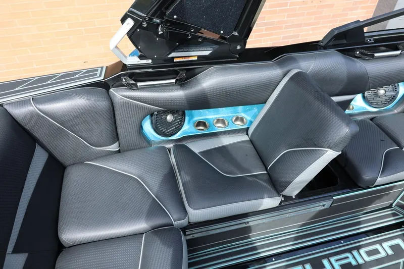 Slide: The Image of 2021 Centurion Fi23 boat interior with sleek black seating and integrated speakers. - 39