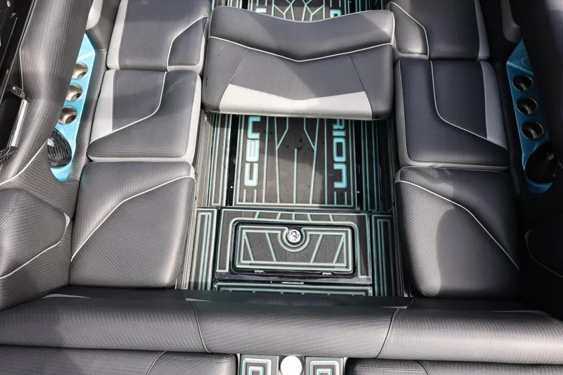 Slide: The Image of 2021 Centurion Fi23 boat interior with sleek black seating and modern design. - 42