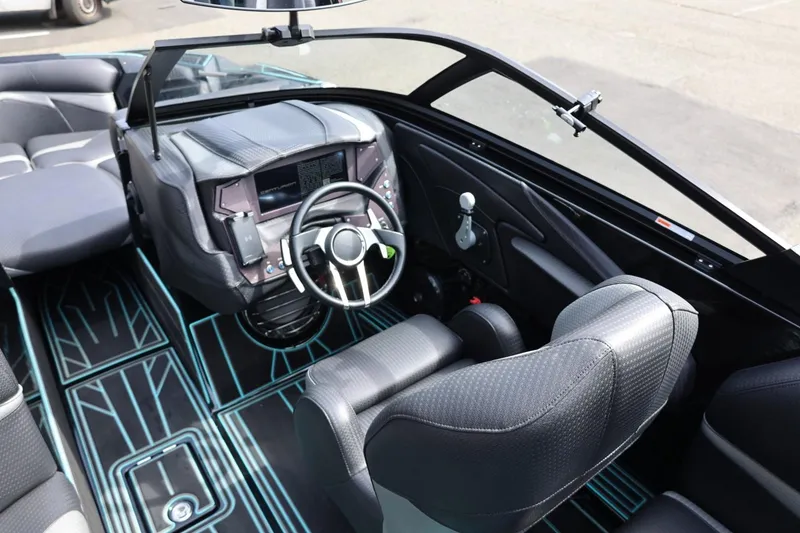 Slide: The Image of 2021 Centurion Fi23 boat interior with modern dashboard and sleek seating design. - 45