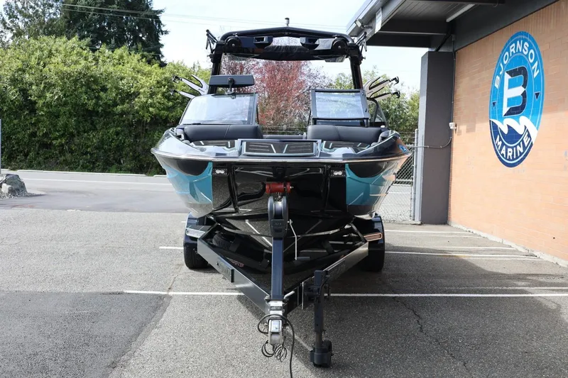 Slide: The Image of 2021 Centurion Fi23 boat on trailer at Bjornson Marine dealership. - 5