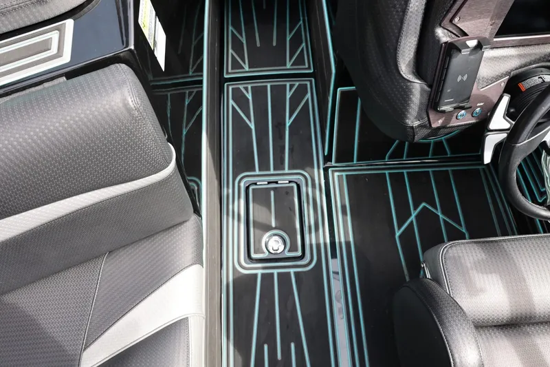 Slide: The Image of 2021 Centurion Fi23 interior with sleek black and gray seating, modern dashboard, and stylish flooring. - 52