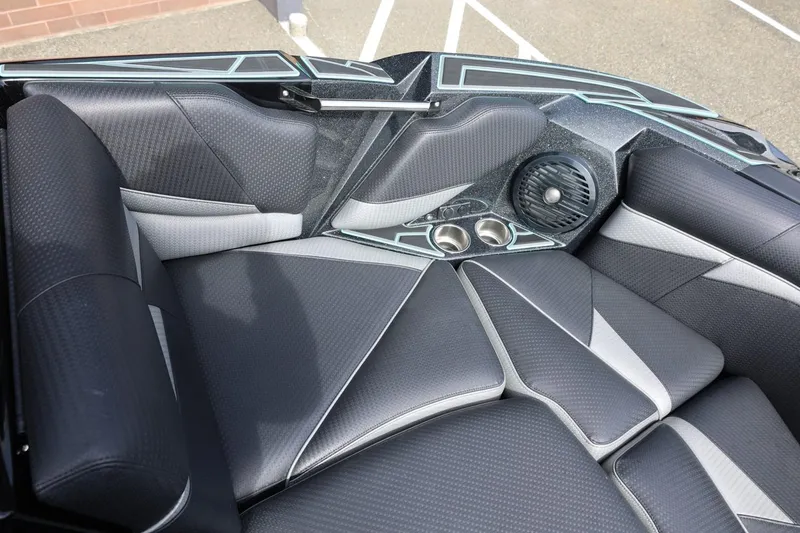 Slide: The Image of Luxurious interior of a 2021 Centurion Fi23 boat with sleek seating and built-in speakers. - 55