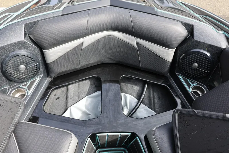 Slide: The Image of Interior of a 2021 Centurion Fi23 boat, featuring sleek seating and built-in speakers. - 59