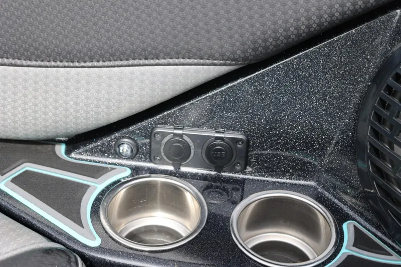 Slide: The Image of Interior of 2021 Centurion Fi23 boat with cup holders and USB ports. - 60