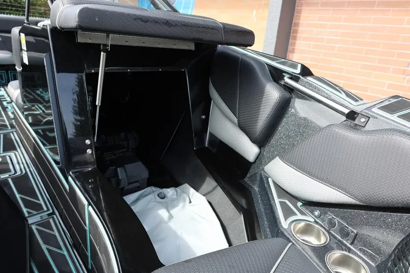 Slide: The Image of Interior of a 2021 Centurion Fi23 boat, featuring seating and storage compartments. - 61