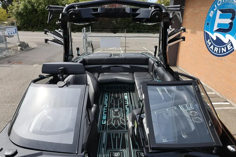 Slide: The Image of 2021 Centurion Fi23 boat interior with sleek black seating and modern design elements. - 62