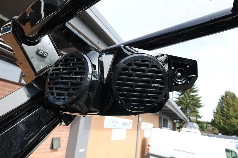 Slide: The Image of Centurion Fi23 2021 boat speakers, mounted on a sleek black frame, outdoors. - 64