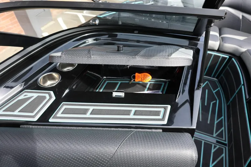 Slide: The Image of 2021 Centurion Fi23 boat interior with sleek black dashboard and modern design elements. - 67