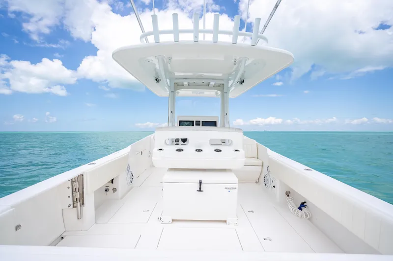 Slide: The Image of 2015 Intrepid 400 Cuddy boat on open sea under clear blue sky. - 24