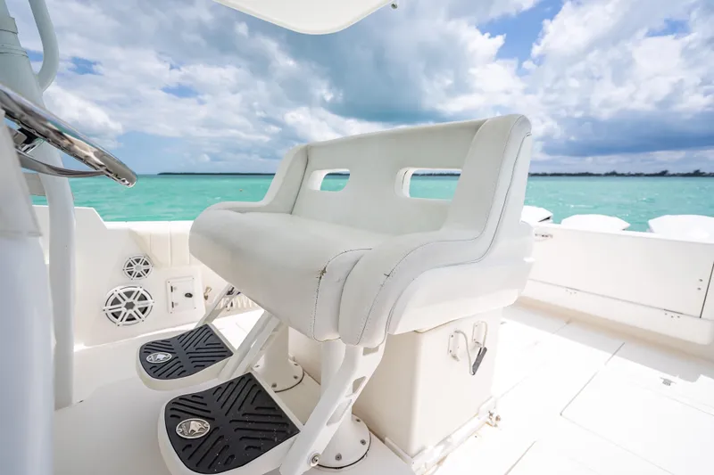 Slide: The Image of Luxury seating on 2015 Intrepid 400 Cuddy boat with ocean view. - 26