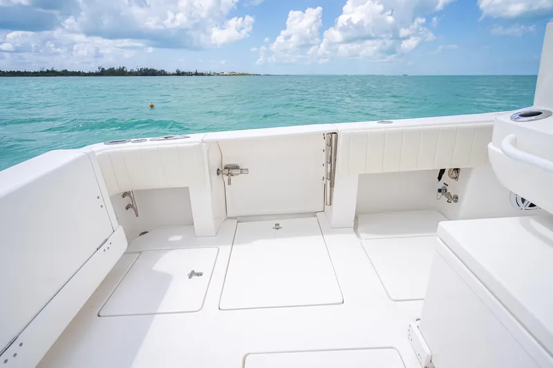 Slide: The Image of 2015 Intrepid 400 Cuddy boat deck with ocean view and clear skies. - 33