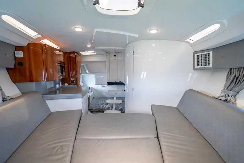 Slide: The Image of Interior of 2015 Intrepid 400 Cuddy boat with modern amenities and seating. - 42