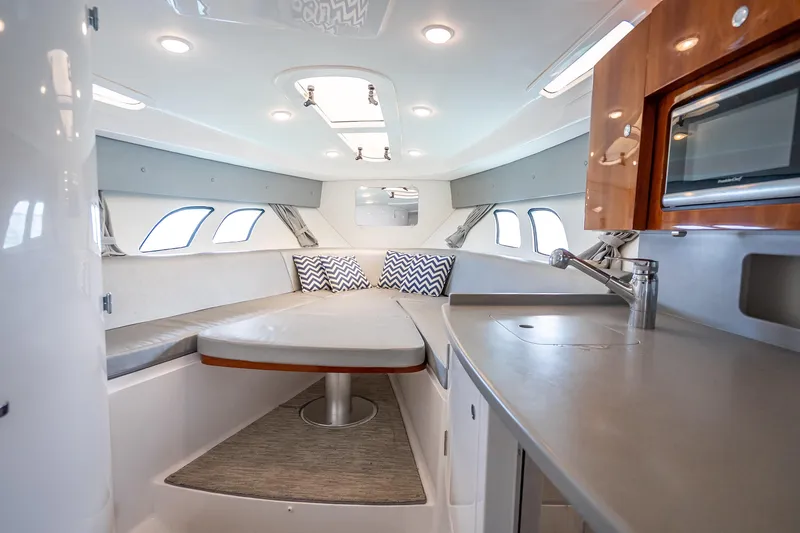 Slide: The Image of Luxurious interior of 2015 Intrepid 400 Cuddy boat with modern kitchen and seating area. - 45