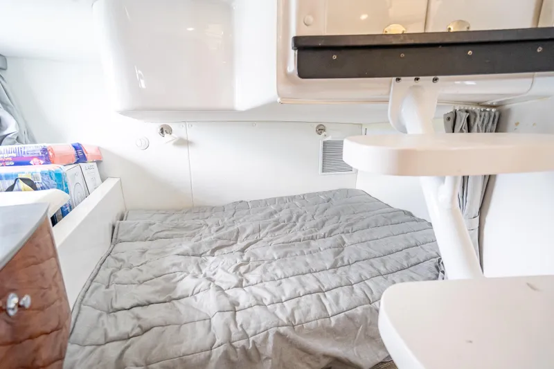 Slide: The Image of 2015 Intrepid 400 Cuddy cabin interior with cozy bed and modern design. - 46