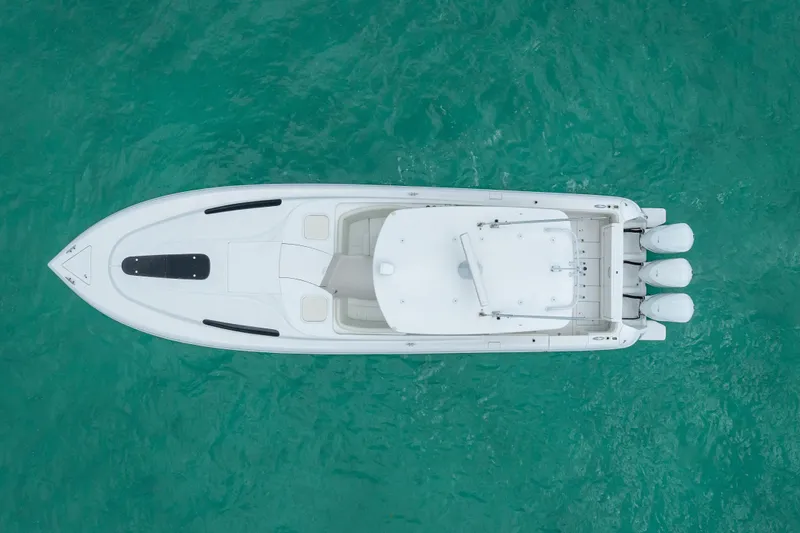 Slide: The Image of Overhead view of 2015 Intrepid 400 Cuddy boat on turquoise water. - 7