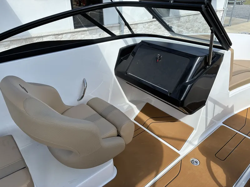 Slide: The Image of Interior of 2026 Bayliner V20 with beige seat and dashboard. - 10