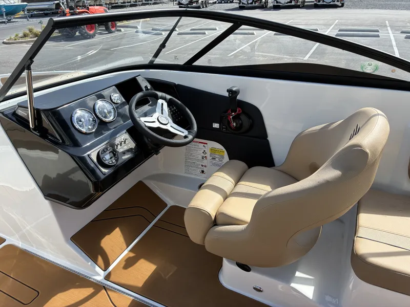 Slide: The Image of Interior view of 2026 Bayliner V20 with steering console and seat. - 11