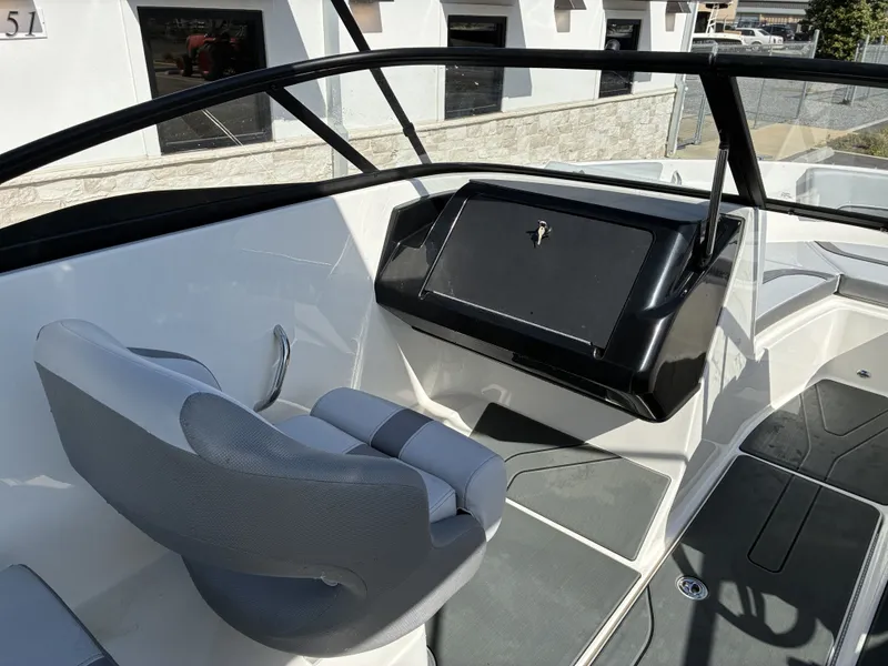 Slide: The Image of Interior of 2026 Bayliner V20 with gray seat and dashboard. - 10