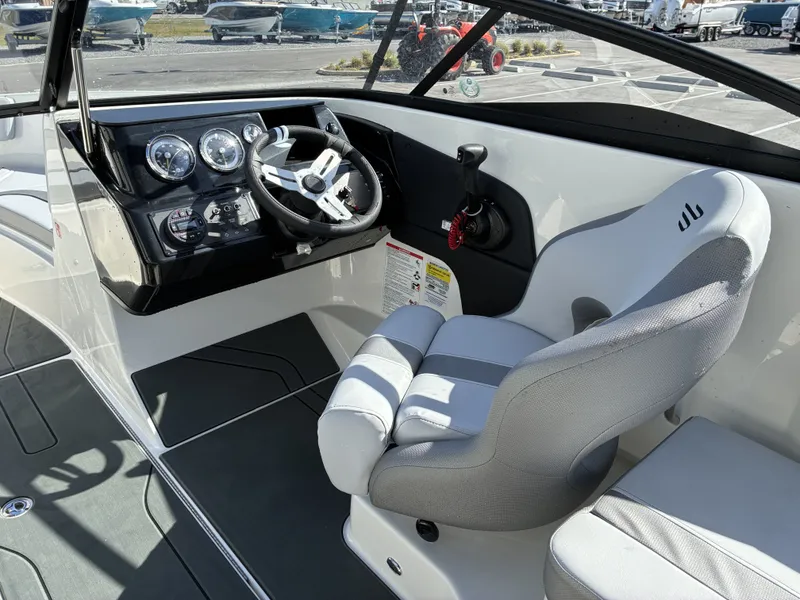 Slide: The Image of Interior of 2026 Bayliner V20 with steering console and seat. - 11