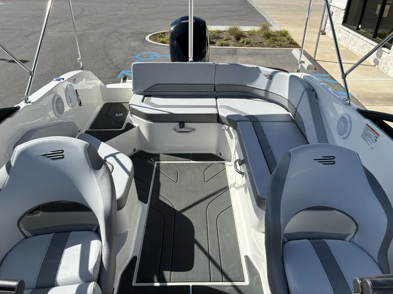 Slide: The Image of Interior of 2026 Bayliner V20 boat with gray seating. - 13