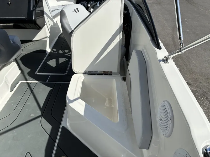 Slide: The Image of Interior of a 2026 Bayliner V20 boat with open storage compartment. - 15