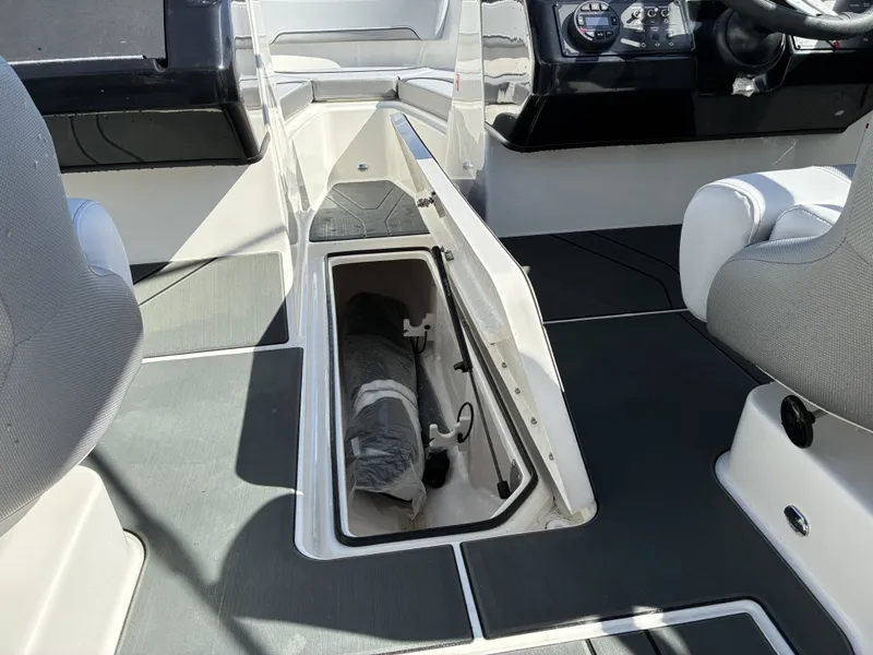 Slide: The Image of Interior of Bayliner V20 2026 with open storage compartment. - 16